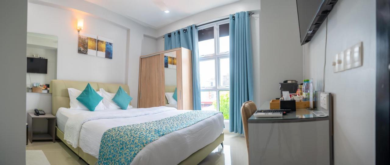Tour Inn Male Bagian luar foto